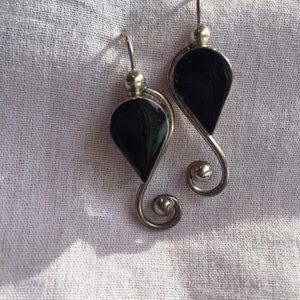 Beautiful hand made black earrings. Signed